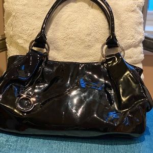 Patent leather Salvatore Ferregamo bag in black.